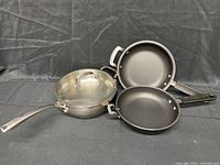 All three pans and lid grouped