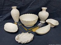 Group shot of all Lenox porcelain pieces and utensils