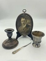 Overview of candlestick, frame, vase and letter opener