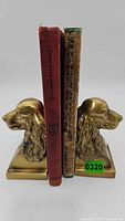 Front view of brass bookends holding two spaniel books