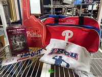 Overall lot with bobblehead box, foam finger, duffle bag, T-shirt, decals