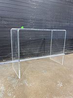 full view of clear lucite console table