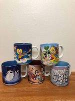 All five Disney mugs with varied character scenes