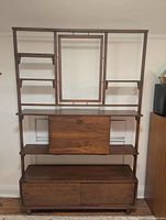 Full view of room divider showing shelves, drop-front cabinet and lower drawers