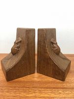 front view of both wood bookends showing carved mice