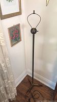 Full view of brass floor lamp with base and cord