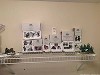 Shelf view showing all boxed figurine sets and unboxed landscape pieces