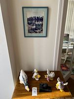 All items together on table and framed print above