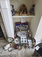 Overall lot showing nativity, plates, bowls, figurines and village set
