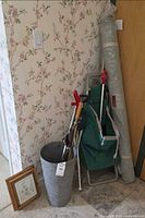 Group shot showing trolley, fabric roll, umbrella stand with two umbrellas, key cabinet