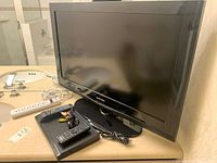 Samsung 32-inch TV with stand shown on countertop