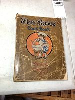 Front cover of 1915 Five Roses Cook Book showing illustration and title