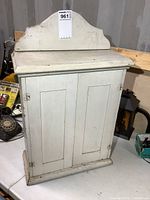 Front view showing double doors and crest top