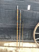 Full view of the three bamboo rod sections leaning against door