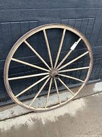 Full view of wagon wheel leaning against door