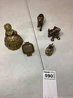 Overview of five brass items