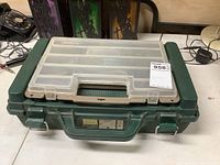 Closed green Woodstream tackle box with clear lid