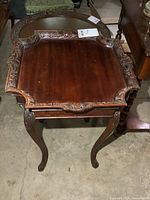 Top view showing carved rim and wood grain