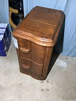 Three-quarter front view showing two drawers and overall style