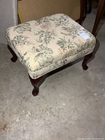 Top and legs of rectangular floral ottoman