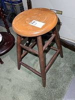 Stool full view showing seat and legs