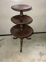 Full view of three-tier pedestal table