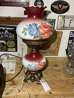 Full view of lamp showing shade, base, cord, and size tag