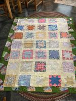 Full view of quilt laid flat showing pattern and size