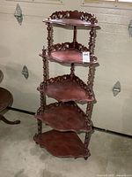 Full view of five-tier corner shelf showing overall design and finish