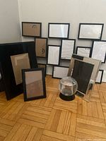 Group of frames and paperweight displayed together