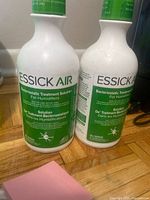 Front view of both Essick Air Bacteriostatic Treatment bottles showing labels and caps
