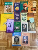 Group shot showing all 14 paperback books laid out flat, titles and covers visible