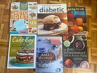 All six cookbooks and health-diet books laid out showing front covers.