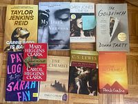 All nine book covers laid out for full title and condition view