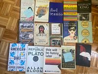 All 15 paperback books laid out showing front covers and titles