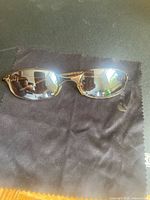 Top view of mirrored sunglasses on microfiber cloth
