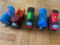 Four of the five vehicles lined up on floor