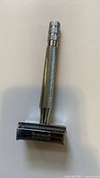 Full view of Wilkinson Sword safety razor showing knurled handle and butterfly head