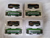 Eight streetcars in four plastic trays