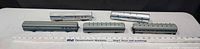 Five B&O passenger cars on table with ruler for scale