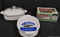 All three CorningWare dishes: rectangular with lid, oval without lid, boxed oval dish