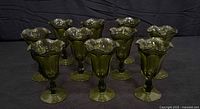 Full set of ten green ruffled sundae cups on display