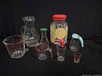 overall group of pitchers and measuring cups