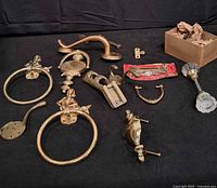 Group shot of all brass hardware showing variety and scale