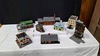 All seven HO scale buildings arranged on table