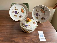 Three Royal Worcester Evesham pattern bakeware pieces: pie plate, quiche dish, covered dish