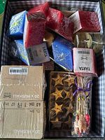 Box overview showing various candle types and packaging