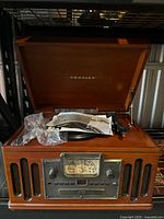 Lid open showing entire unit, front controls and speakers