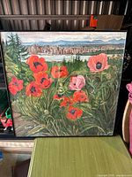 Front view of the signed painting showing poppies, cityscape, signature lower left