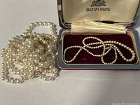 Bedforde cased necklace and two loose pearl strands